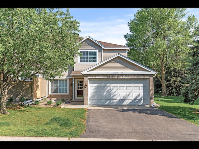 8484 Minuteman Alcove, Eden Prairie, MN 55344 - view of front of house featuring asphalt driveway, a front yard, a garage, and brick siding