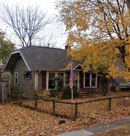 5333 30th Ave S, Minneapolis, MN 55417 - view of front of house with a fenced front yard, a chimney, and roof with shingles