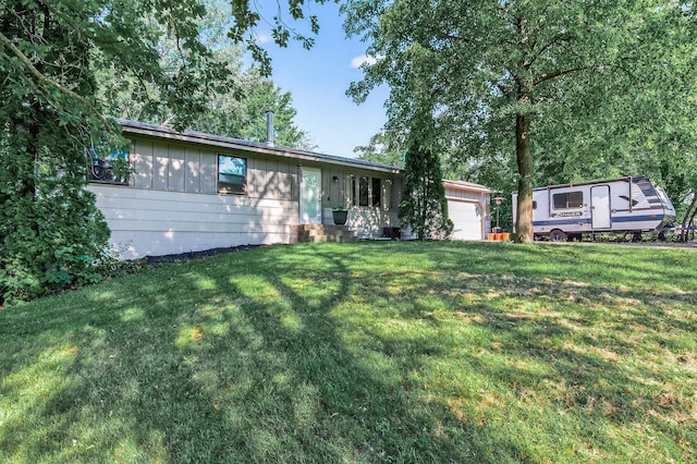15106 Zuni St NW, Ramsey, MN 55303 - ranch-style house featuring a front yard, board and batten siding, and a garage