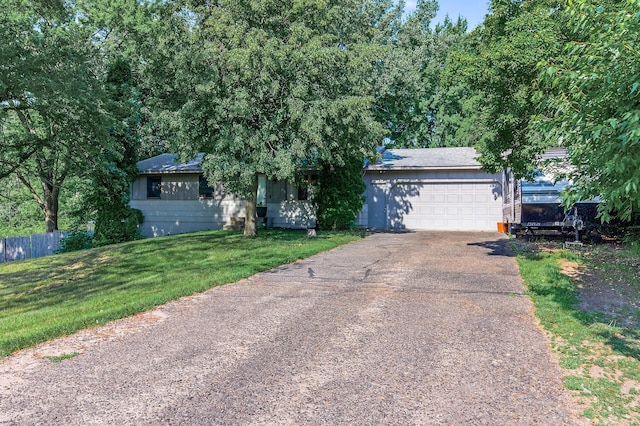15106 Zuni St NW, Ramsey, MN 55303 - obstructed view of property featuring a garage, asphalt driveway, and roof with shingles