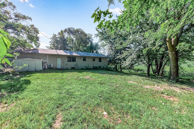 15106 Zuni St NW, Ramsey, MN 55303 - view of green lawn with a shed