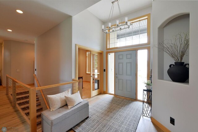 4703 Woodhaven St S, Fargo, ND 58104 - foyer entrance featuring wood finished floors, recessed lighting, a towering ceiling, and a chandelier