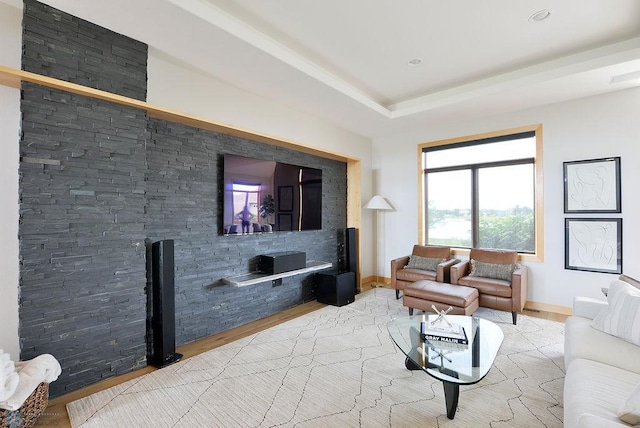 4703 Woodhaven St S, Fargo, ND 58104 - living room featuring light wood finished floors and a raised ceiling