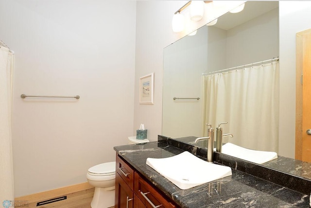 4703 Woodhaven St S, Fargo, ND 58104 - bathroom featuring vanity, wood finished floors, and a shower with shower curtain
