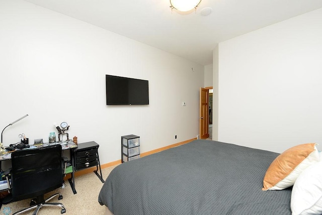 4703 Woodhaven St S, Fargo, ND 58104 - bedroom with light colored carpet and an office area