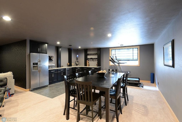 4703 Woodhaven St S, Fargo, ND 58104 - dining space featuring bar area and recessed lighting