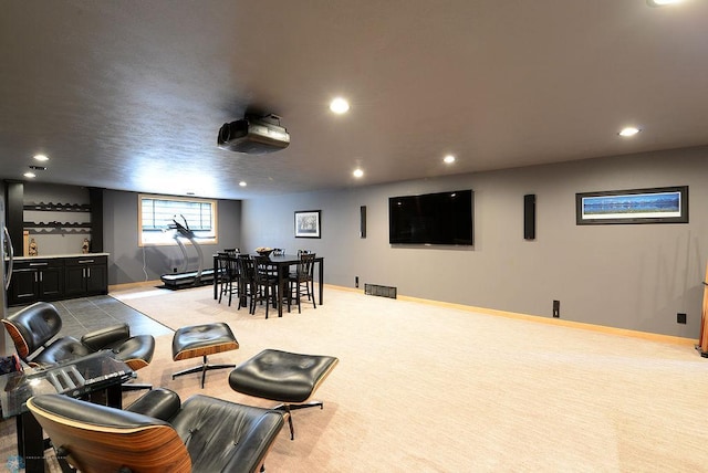 4703 Woodhaven St S, Fargo, ND 58104 - carpeted cinema room featuring bar area and recessed lighting