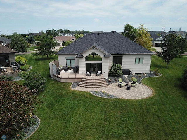 4703 Woodhaven St S, Fargo, ND 58104 - rear view of property with a deck, a patio area, a shingled roof, and a lawn