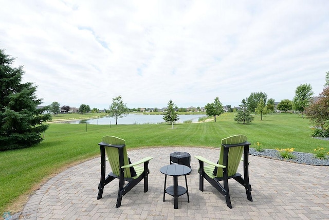 4703 Woodhaven St S, Fargo, ND 58104 - view of patio with a water view