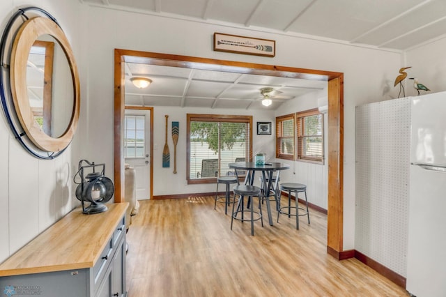 27096 Little Floyd Lake Rd Unit 8, Detroit Twp, MN 56501 - dining room featuring light wood-style flooring, ceiling fan, and coffered ceiling