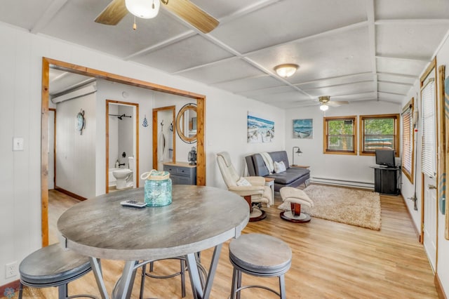 27096 Little Floyd Lake Rd Unit 8, Detroit Twp, MN 56501 - dining space featuring a ceiling fan, light wood-type flooring, a baseboard radiator, and lofted ceiling