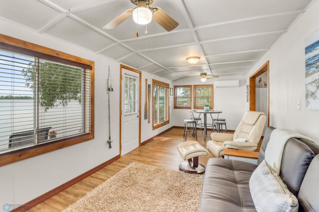 27096 Little Floyd Lake Rd Unit 8, Detroit Twp, MN 56501 - living area featuring light wood finished floors, ceiling fan, and a wall unit AC