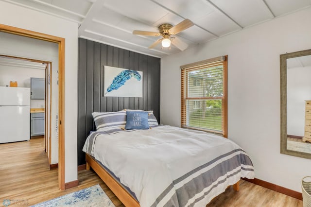 27096 Little Floyd Lake Rd Unit 8, Detroit Twp, MN 56501 - bedroom with freestanding refrigerator, light wood-type flooring, and ceiling fan