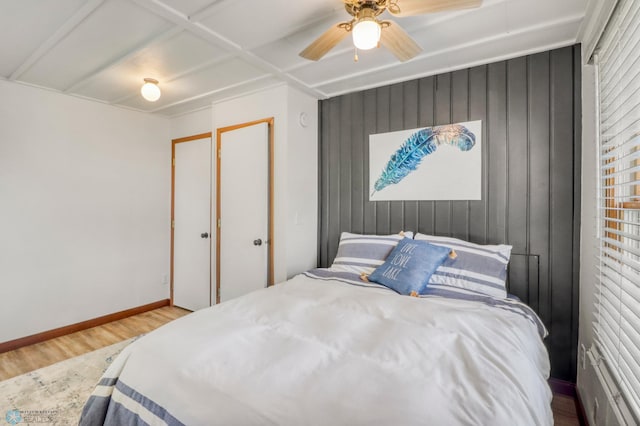 27096 Little Floyd Lake Rd Unit 8, Detroit Twp, MN 56501 - bedroom featuring wood finished floors, wooden walls, and ceiling fan