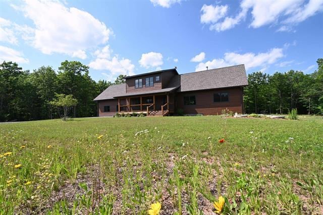 12207 Railroad Rd, Lake Nebagamon, WI 54849 - rear view of house with a lawn and a porch