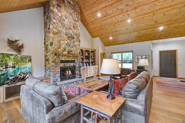 12207 Railroad Rd, Lake Nebagamon, WI 54849 - living area featuring wood finished floors, wooden ceiling, high vaulted ceiling, a fireplace, and recessed lighting
