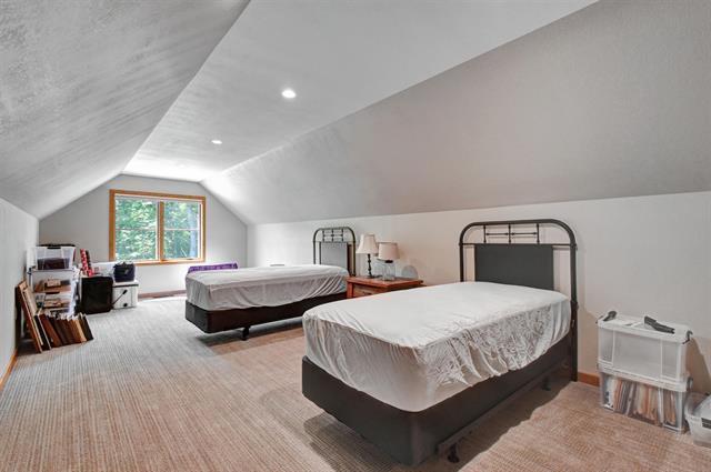 12207 Railroad Rd, Lake Nebagamon, WI 54849 - bedroom featuring lofted ceiling and carpet floors