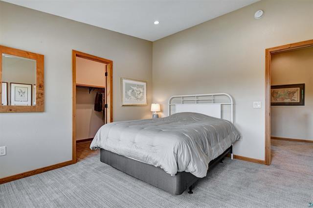 12207 Railroad Rd, Lake Nebagamon, WI 54849 - carpeted bedroom featuring a spacious closet and recessed lighting