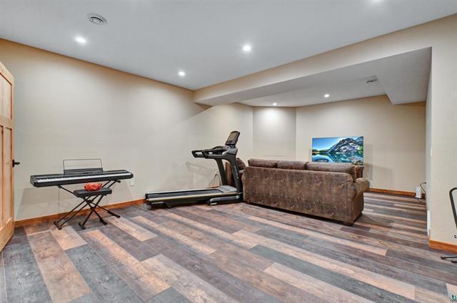 12207 Railroad Rd, Lake Nebagamon, WI 54849 - workout area with wood finished floors and recessed lighting