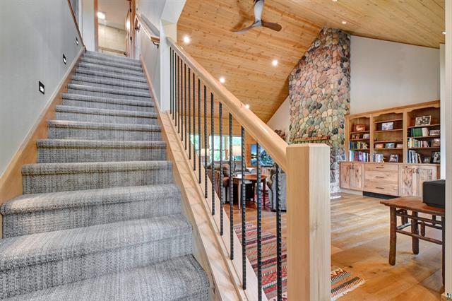 12207 Railroad Rd, Lake Nebagamon, WI 54849 - stairs with a ceiling fan, high vaulted ceiling, wood ceiling, wood finished floors, and recessed lighting