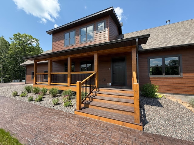 12207 Railroad Rd, Lake Nebagamon, WI 54849 - view of front facade featuring a porch and a shingled roof