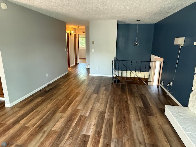 1303 Duluth Ave N, Thief River Falls, MN 56701 - spare room with a textured ceiling and wood finished floors