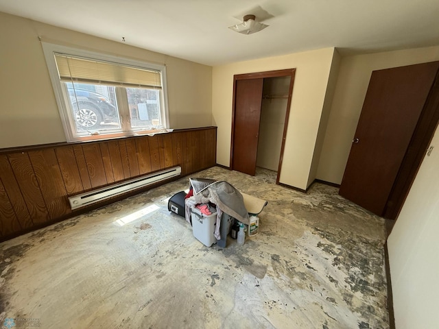1303 Duluth Ave N, Thief River Falls, MN 56701 - unfurnished bedroom featuring baseboard heating and a closet