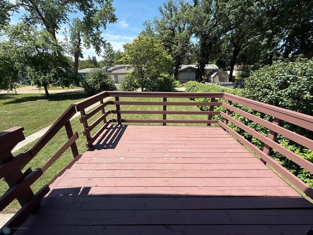 1303 Duluth Ave N, Thief River Falls, MN 56701 - wooden terrace with a yard