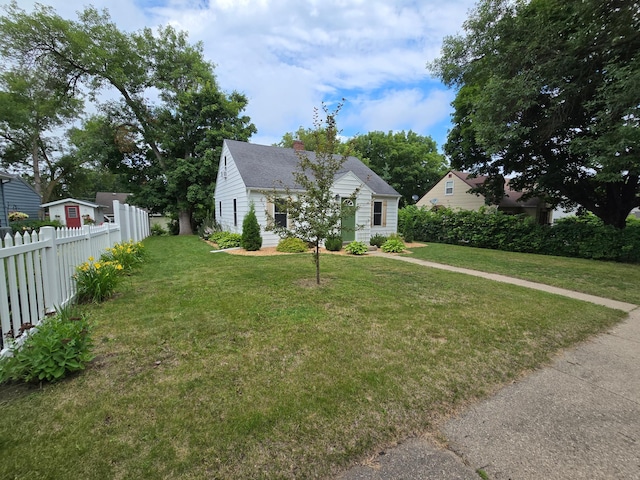818 Kenwood St, Alexandria, MN 56308 - bungalow-style home featuring a chimney and a shingled roof