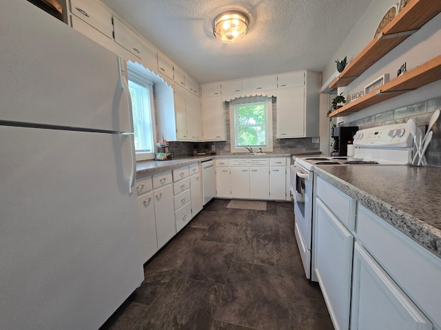 818 Kenwood St, Alexandria, MN 56308 - kitchen featuring white appliances, a textured ceiling, white cabinetry, backsplash, and open shelves