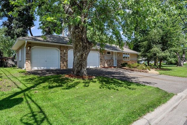4801 Louisiana Ave N, Crystal, MN 55428 - ranch-style home with brick siding, driveway, a front lawn, and an attached garage