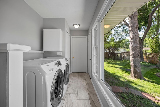4801 Louisiana Ave N, Crystal, MN 55428 - laundry room with washer and clothes dryer and light marble finish floors