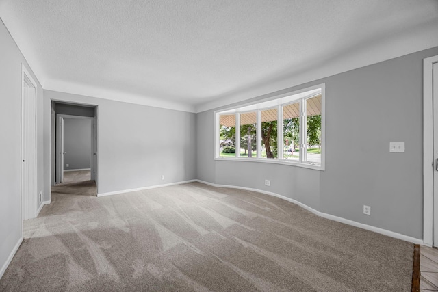 4801 Louisiana Ave N, Crystal, MN 55428 - unfurnished room featuring a textured ceiling and carpet
