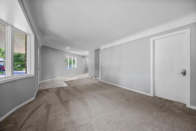 4801 Louisiana Ave N, Crystal, MN 55428 - carpeted spare room with a textured ceiling and baseboards
