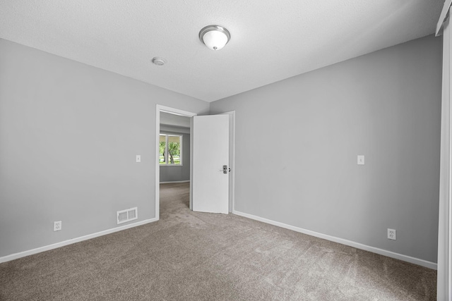 4801 Louisiana Ave N, Crystal, MN 55428 - spare room with carpet, a smoke detector, and a textured ceiling