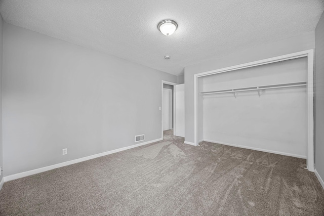 4801 Louisiana Ave N, Crystal, MN 55428 - unfurnished bedroom with a textured ceiling, carpet flooring, and a closet