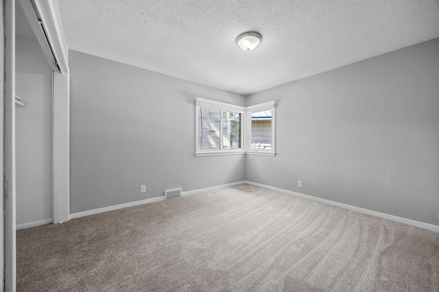 4801 Louisiana Ave N, Crystal, MN 55428 - unfurnished bedroom with a textured ceiling, carpet floors, and a closet