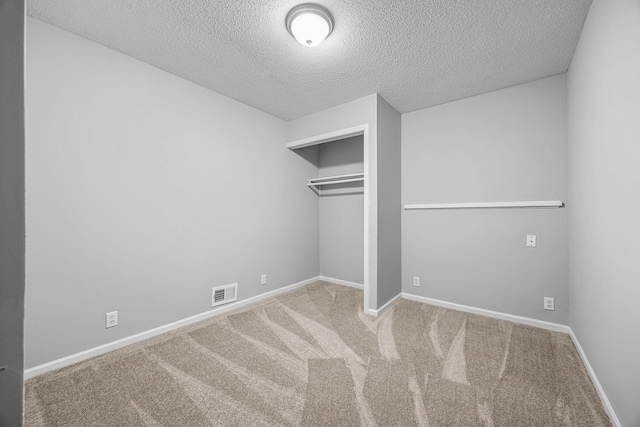 4801 Louisiana Ave N, Crystal, MN 55428 - unfurnished bedroom with a textured ceiling, carpet flooring, and a closet
