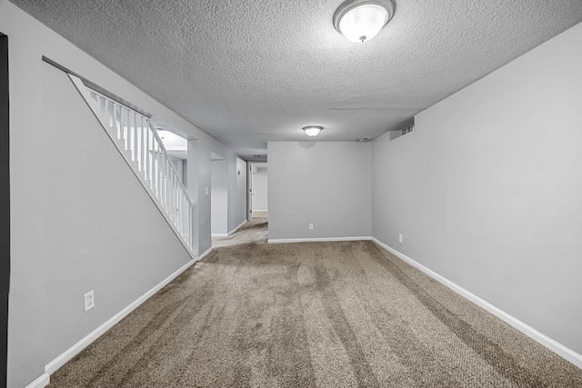 4801 Louisiana Ave N, Crystal, MN 55428 - finished basement with a textured ceiling, stairway, and carpet