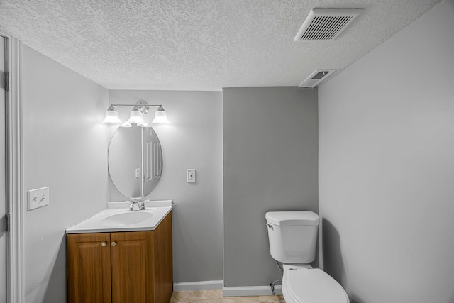 4801 Louisiana Ave N, Crystal, MN 55428 - bathroom featuring a textured ceiling, vanity, and tile patterned floors