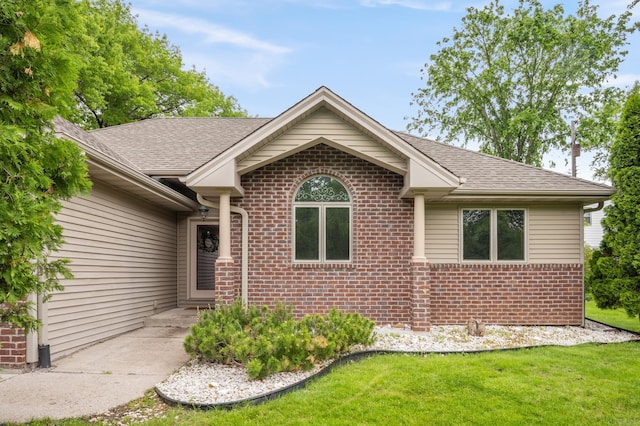 11228 River Rd, Champlin, MN 55316 - ranch-style house featuring brick siding, a front yard, and a shingled roof