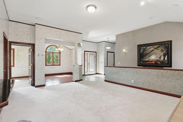 11228 River Rd, Champlin, MN 55316 - unfurnished living room featuring carpet flooring, a chandelier, and wallpapered walls