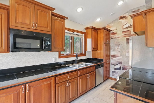 11228 River Rd, Champlin, MN 55316 - kitchen featuring black microwave, dishwasher, brown cabinetry, light tile patterned floors, and recessed lighting