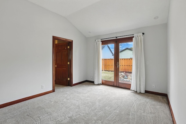 11228 River Rd, Champlin, MN 55316 - spare room with carpet floors, lofted ceiling, and french doors
