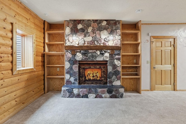 11228 River Rd, Champlin, MN 55316 - living area featuring carpet, a fireplace, and a textured ceiling