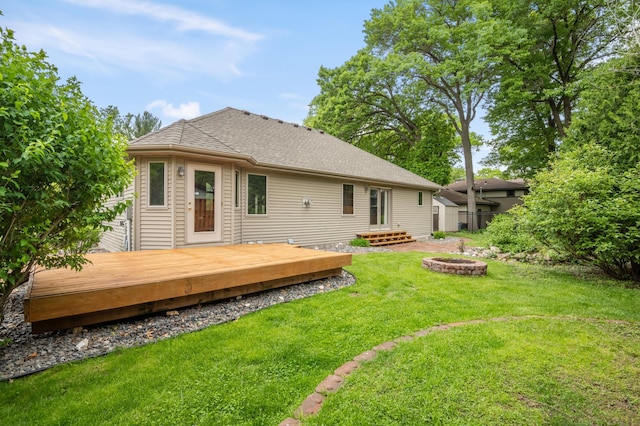 11228 River Rd, Champlin, MN 55316 - rear view of house with an outdoor fire pit and a wooden deck