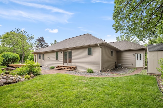 11228 River Rd, Champlin, MN 55316 - rear view of house with a yard and roof with shingles