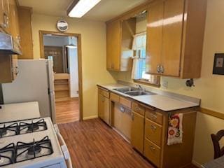 11721 Olive St NW, Coon Rapids, MN 55448 - kitchen with white appliances, wood finished floors, light countertops, and brown cabinets