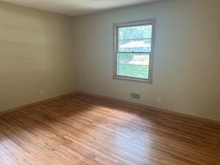 11721 Olive St NW, Coon Rapids, MN 55448 - unfurnished room featuring wood finished floors