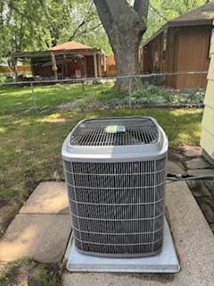 11721 Olive St NW, Coon Rapids, MN 55448 - exterior view of a central AC unit